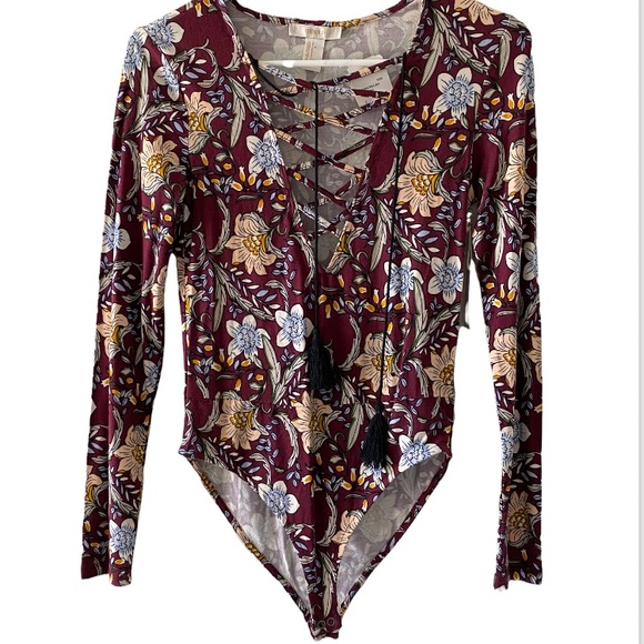 Forever 21 Tops - FLORAL BODYSUIT LONG SLEEVE WITH TASSELS. NEVER WORN. NWT.